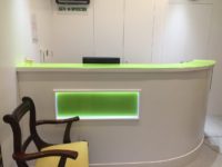 Green glass splashback for reception